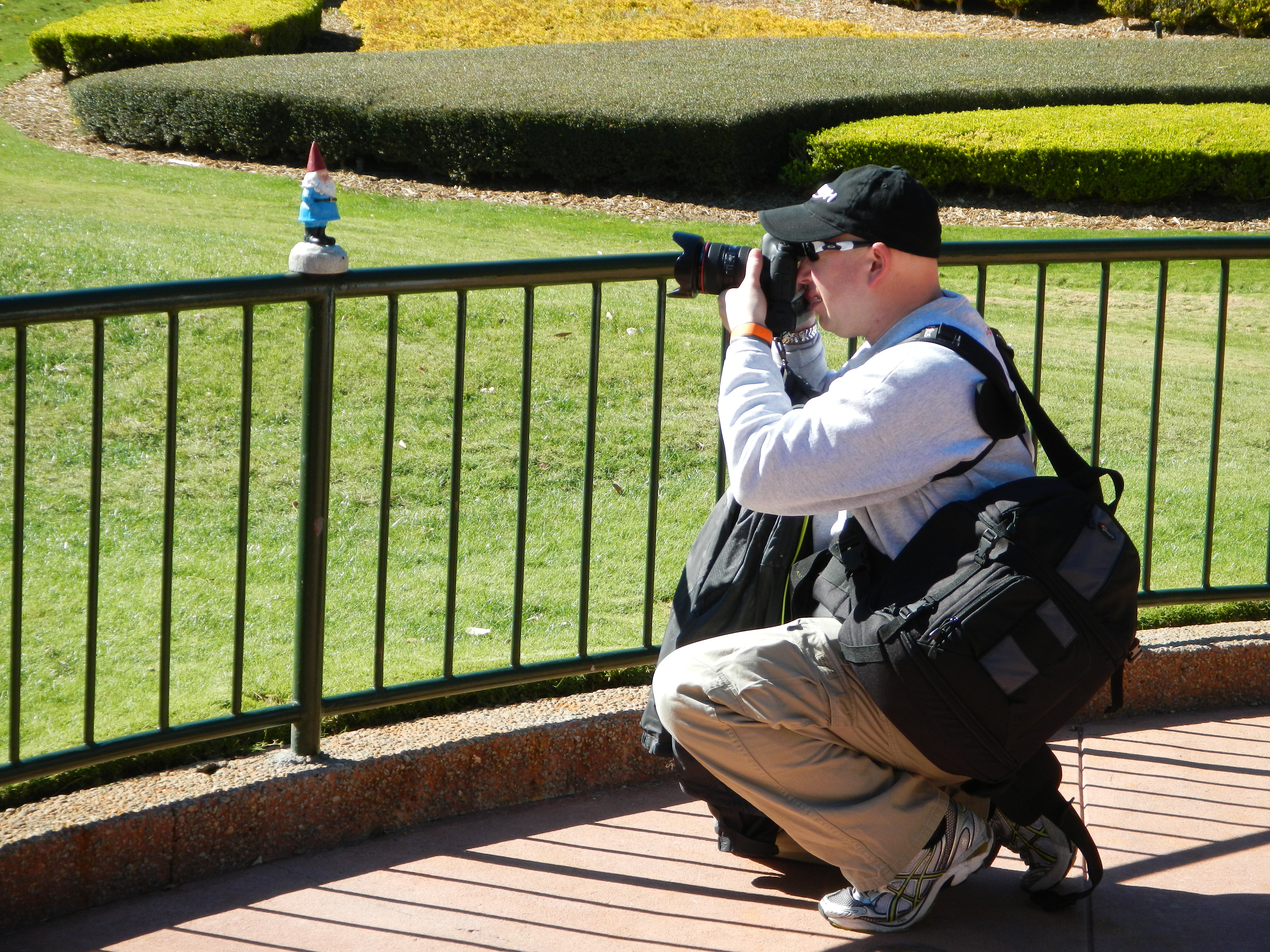 Epcot - Man taking picture of his Roaming Gnome