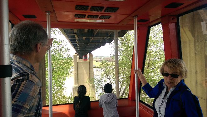 A view from inside our monorail car as another monorail car approaches us